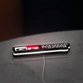 Toyota Gazoo Racing LED lightbox lying flat on a desk with white glow
