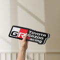 Unlit Toyota Gazoo Racing LED lightbox held by hand to show size and details