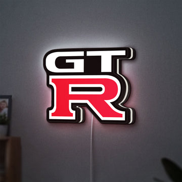 GT-R LED lightbox hanging on a wall with white glow
