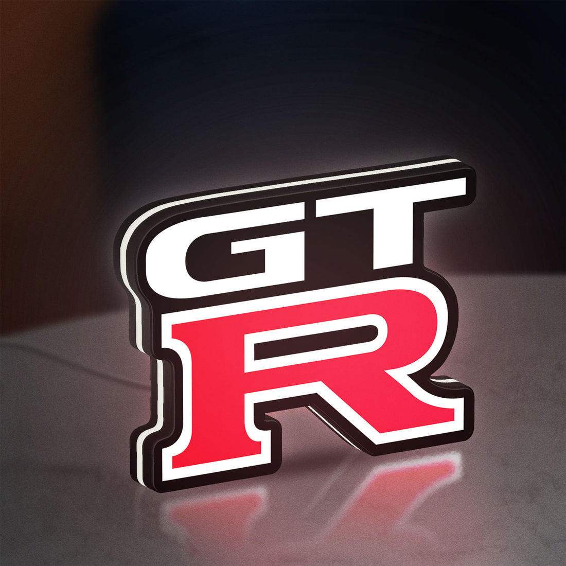GT-R LED lightbox hanging on a wall with white glow