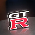 GT-R LED lightbox standing on a desk from an angled side view with white glow