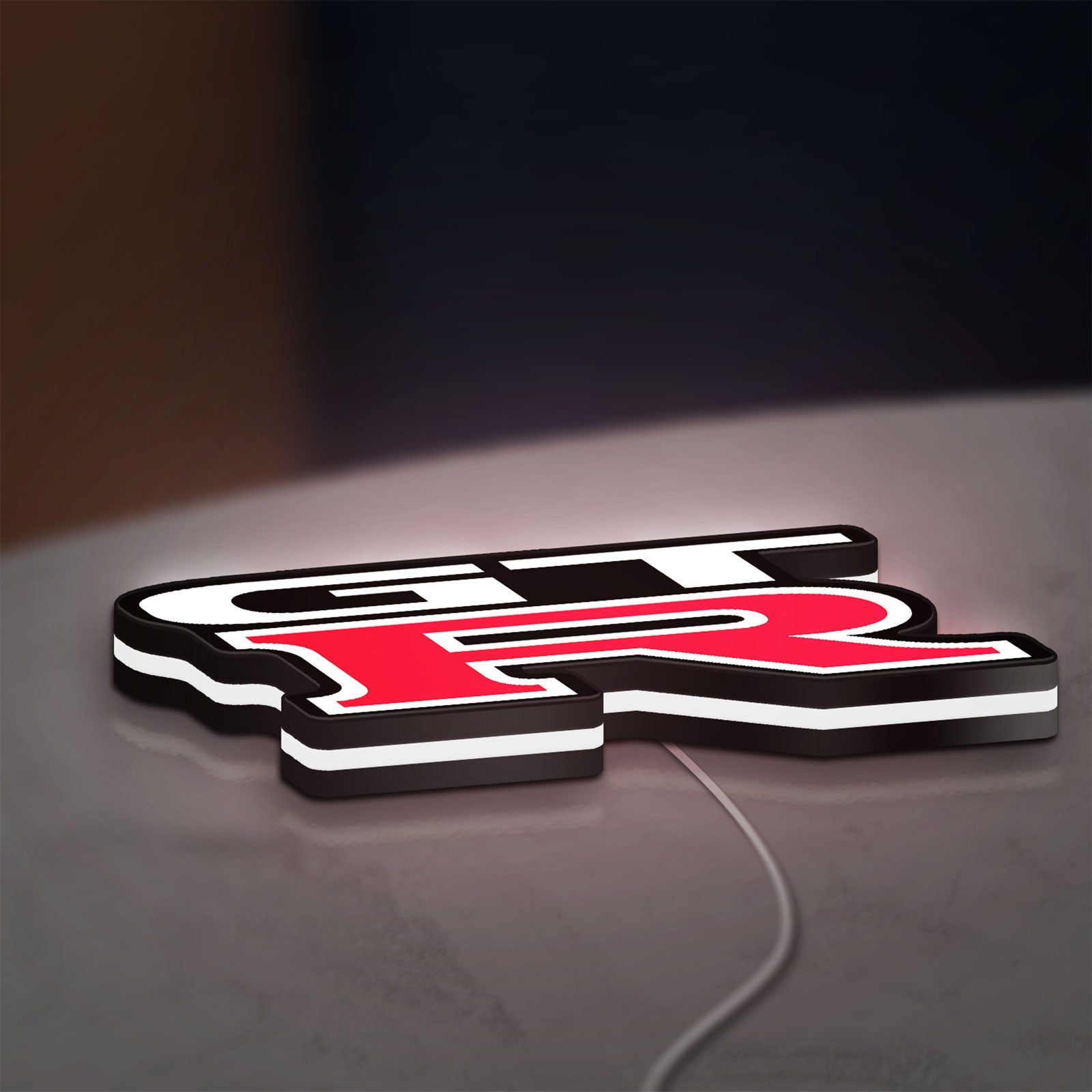 GT-R LED lightbox lying flat on a desk with white glow