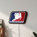 Unlit AMA Motocross LED lightbox mounted on a wall in daylight
