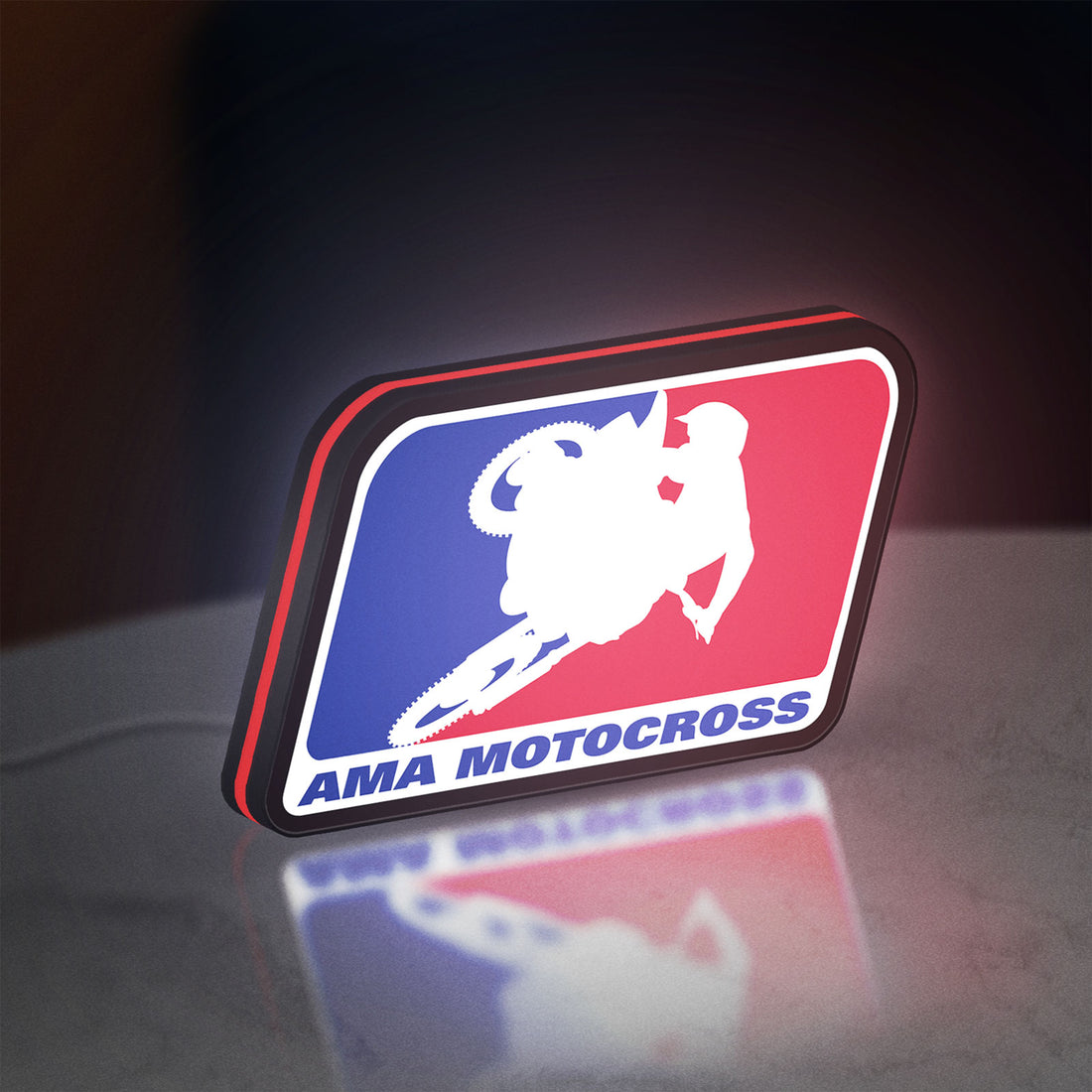 AMA Motocross LED lightbox hanging on a wall with red glow