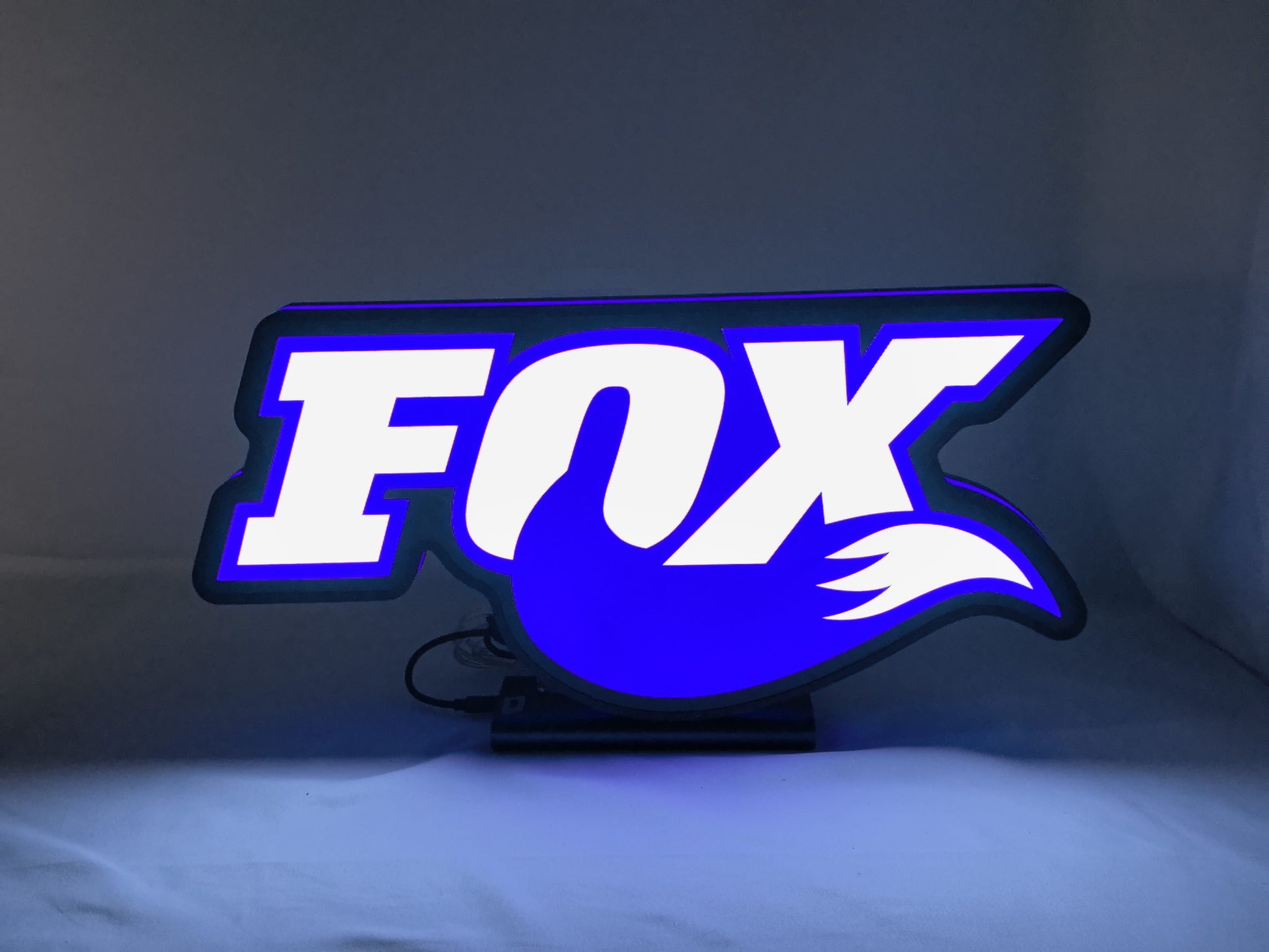 Illuminated front view standing of Fox Racing Shox 3D LED Sign in 40cm, perfect for garage and man cave decor