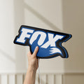 Unlit Fox Racing Shox LED lightbox held by hand to show size and details