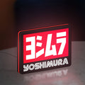 Yoshimura LED lightbox standing on a desk from an angled side view with red glow