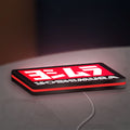 Yoshimura LED lightbox lying flat on a desk with red glow