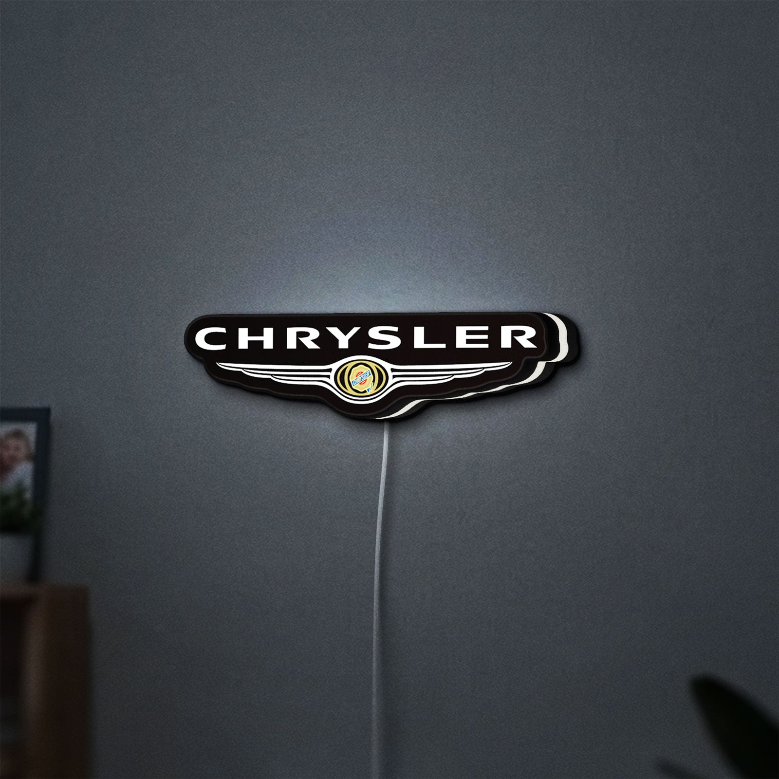 Chrysler LED lightbox hanging on a wall with white glow
