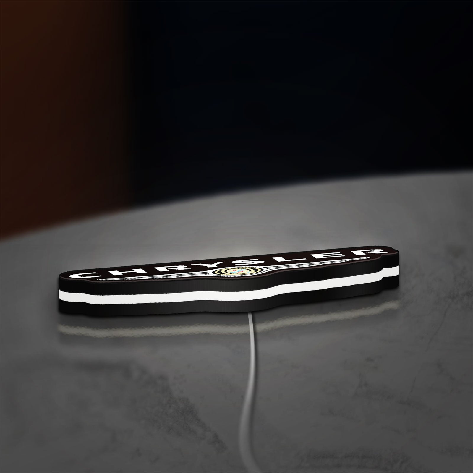 Chrysler LED lightbox lying flat on a desk with white glow