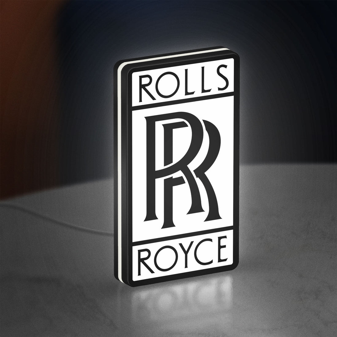 Rolls-Royce LED lightbox hanging on a wall with white glow