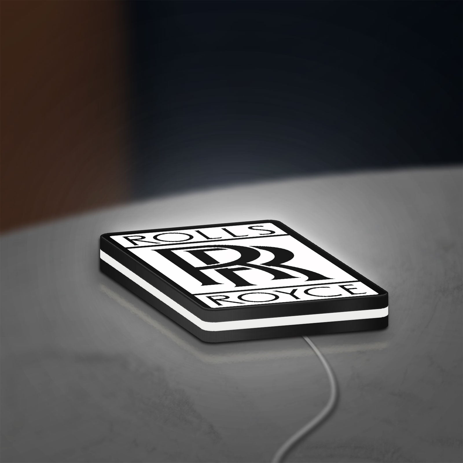 Rolls-Royce LED lightbox lying flat on a desk with white glow