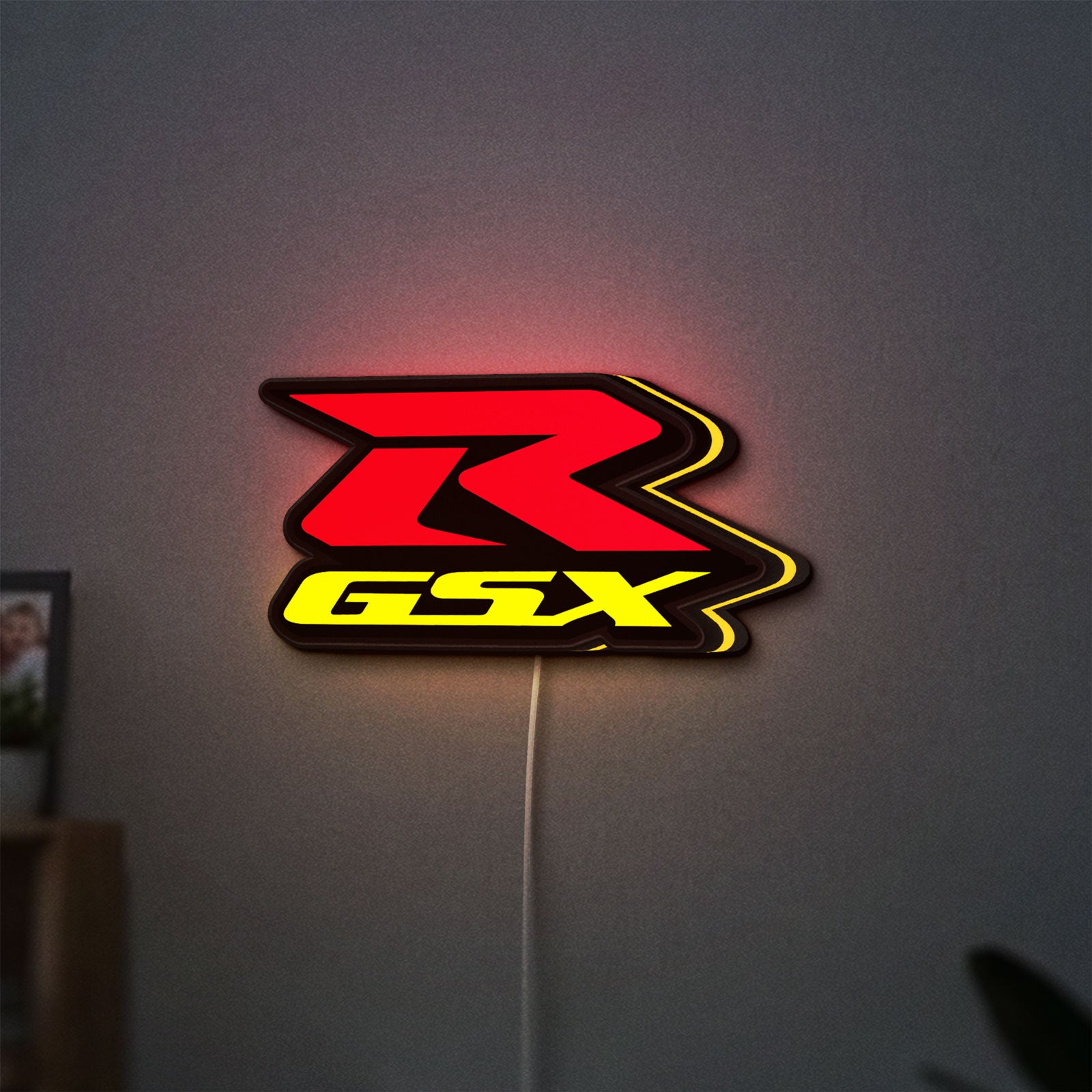 Suzuki GSX-R LED lightbox hanging on a wall with yellow glow