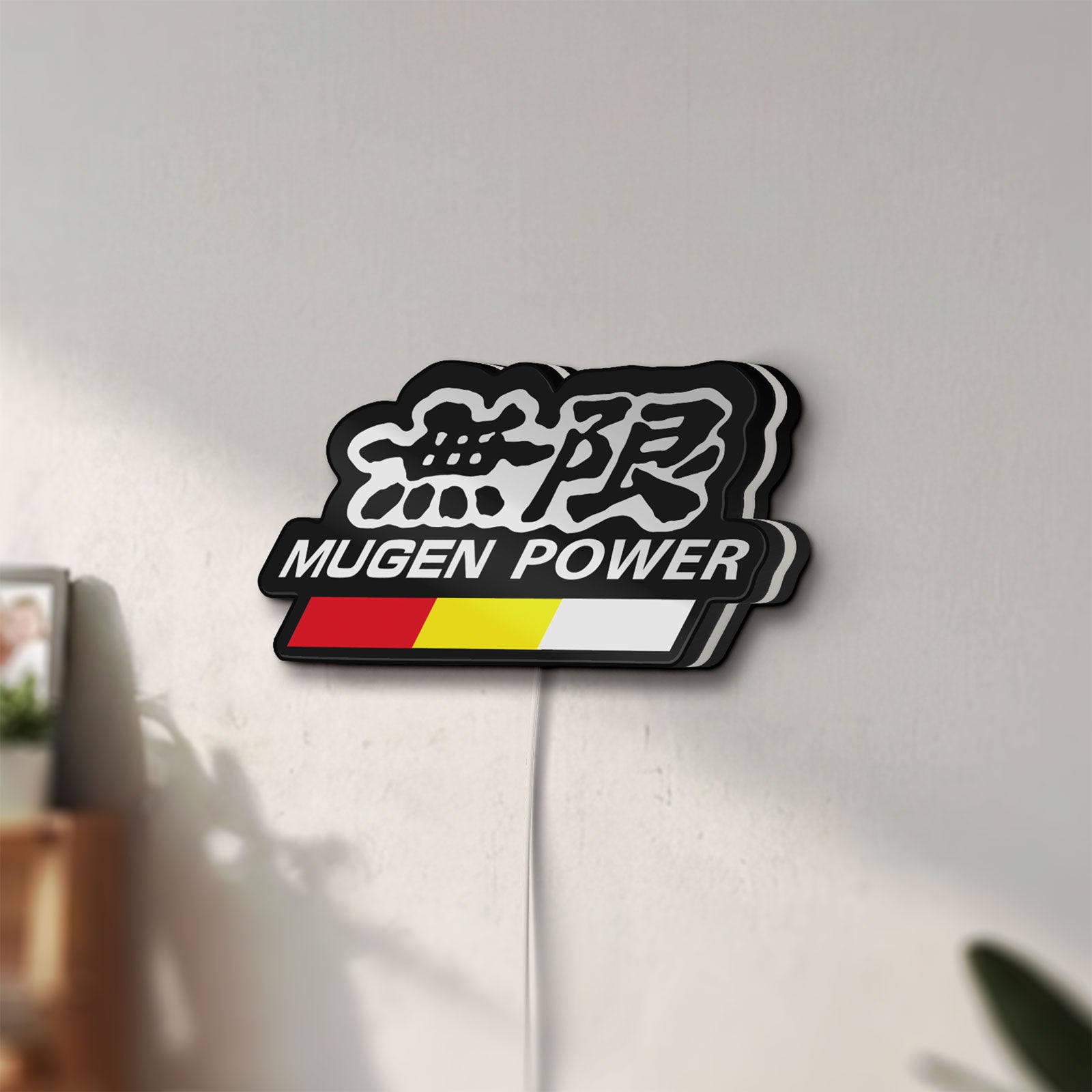 Unlit Mugen LED lightbox mounted on a wall in daylight