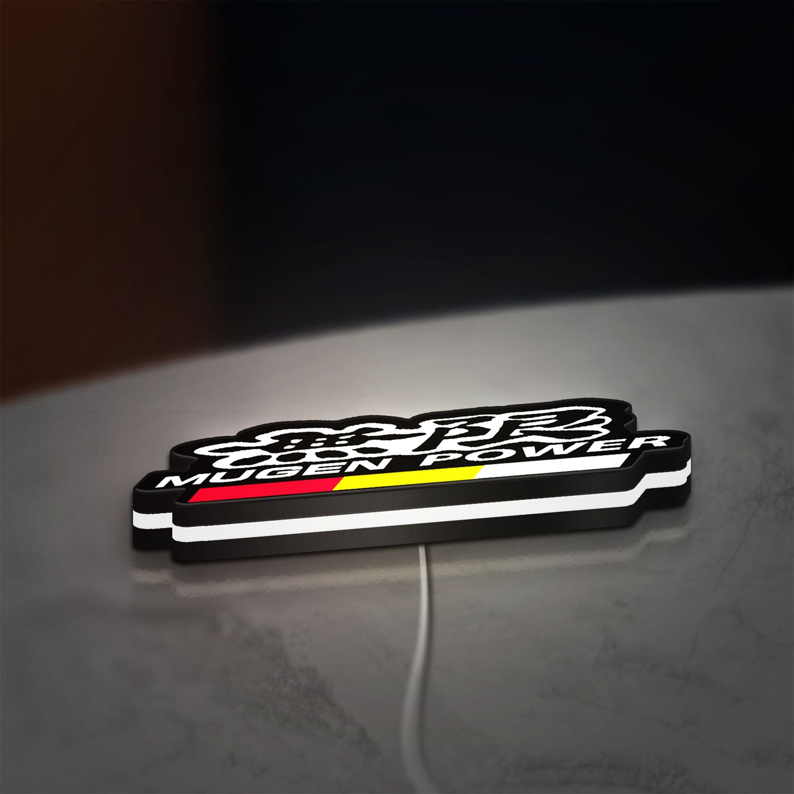 Mugen LED lightbox lying flat on a desk with white glow