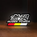 Front view of Mugen LED lightbox sign glowing on a wooden desk
