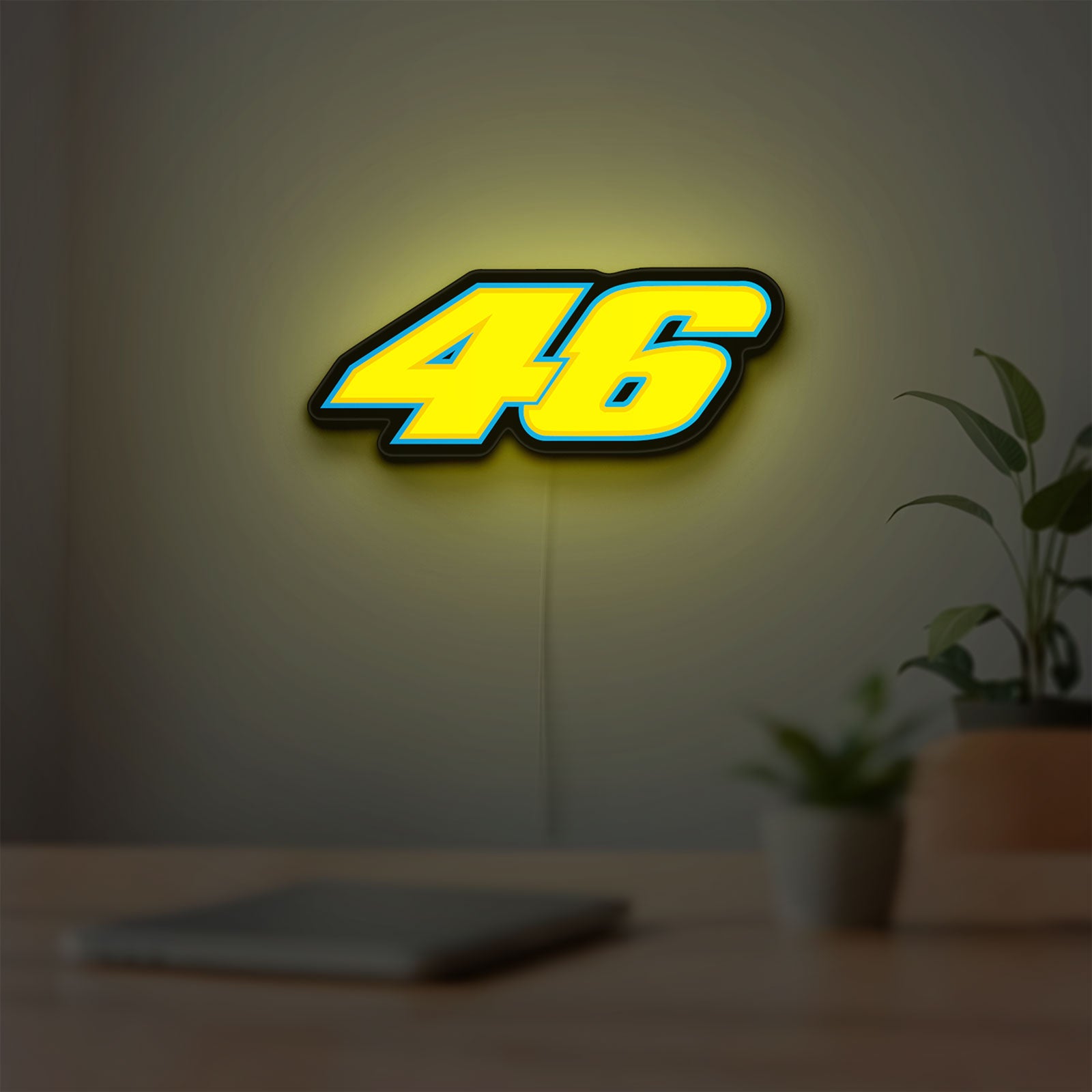Honda 46 LED lightbox hanging on a room wall with soft yellow light