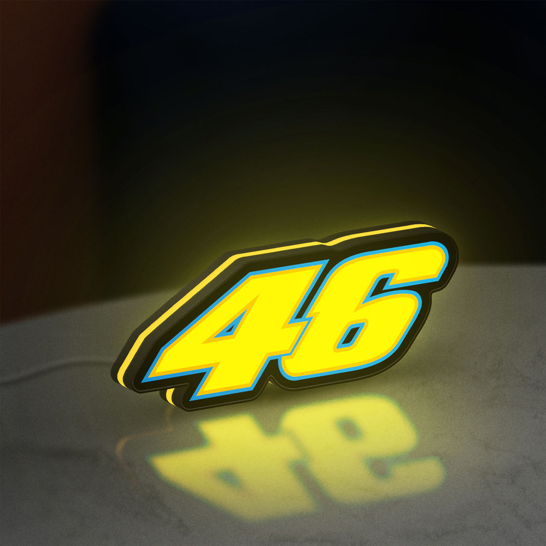 Honda 46 LED lightbox hanging on a wall with yellow glow