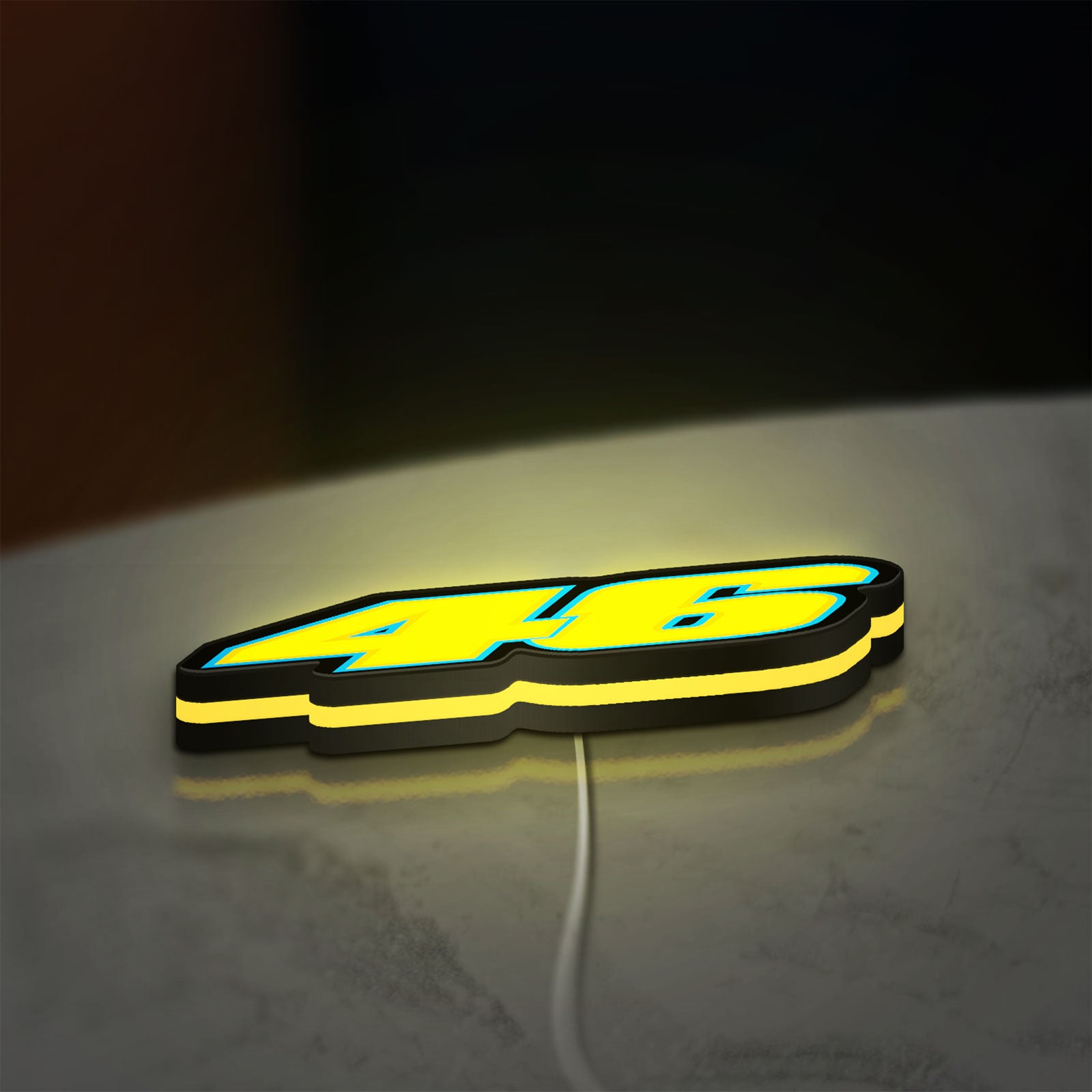 Honda 46 LED lightbox lying flat on a desk with yellow glow