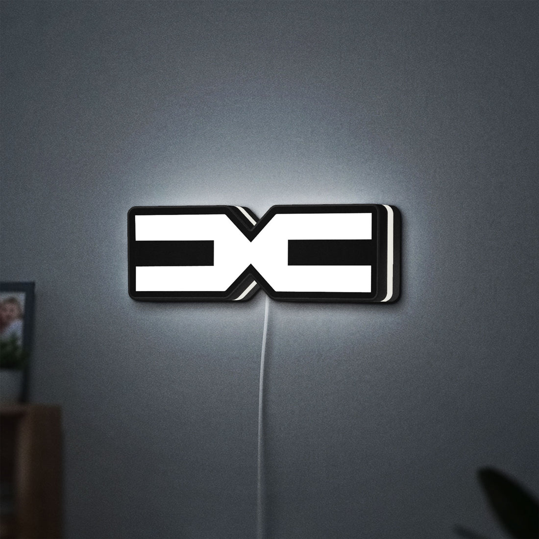 Dacia 2021 LED lightbox hanging on a wall with white glow