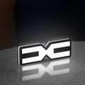 Dacia 2021 LED lightbox standing on a desk from an angled side view with white glow