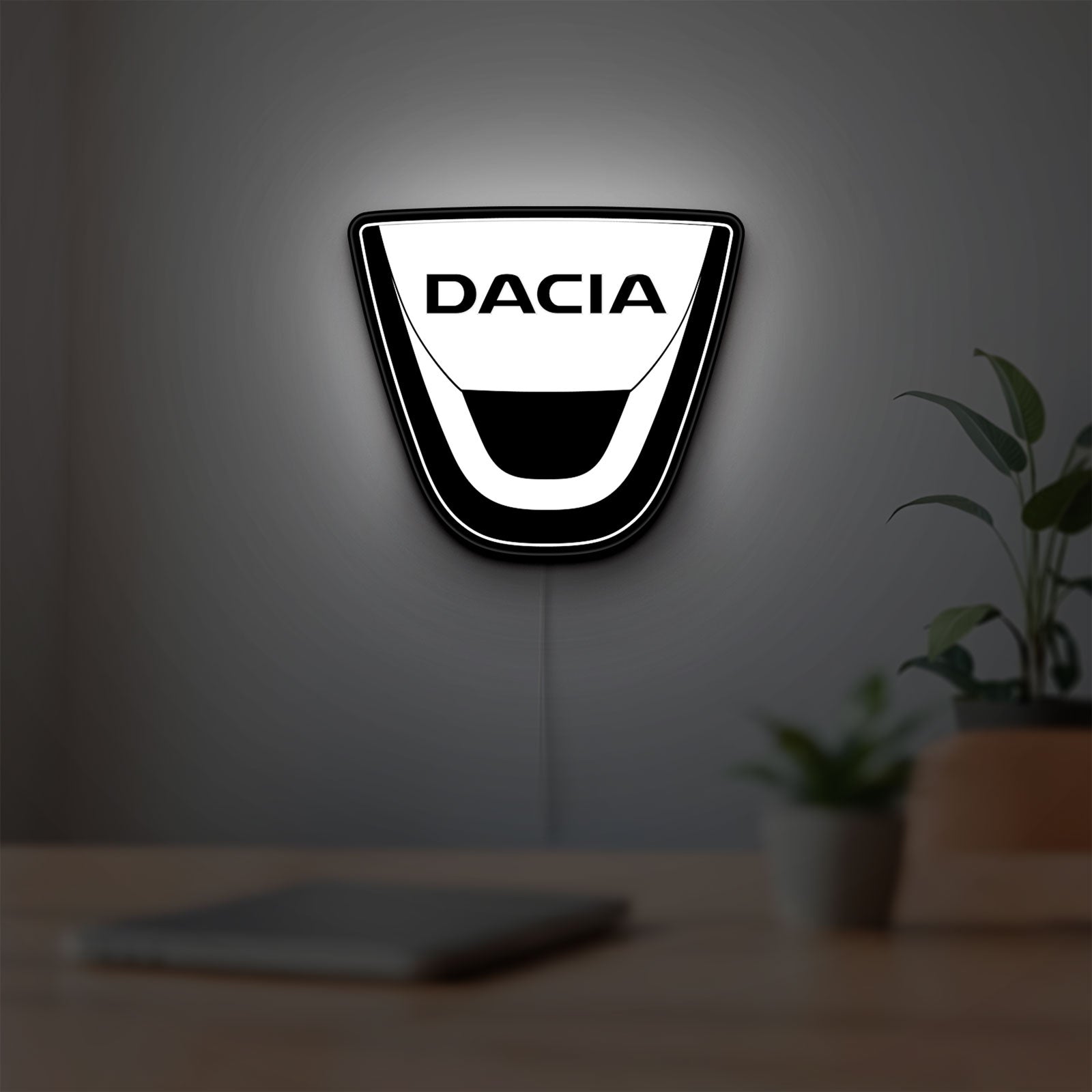 Dacia LED lightbox hanging on a room wall with soft white light