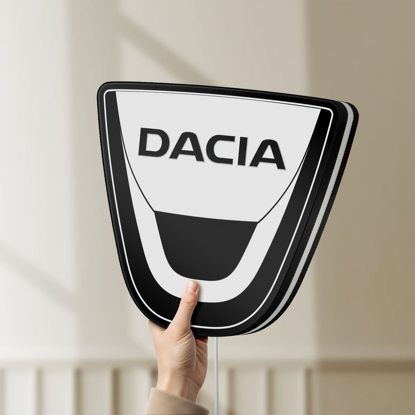 Unlit Dacia LED lightbox held by hand to show size and details