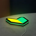 JDM Wakaba Leaf LED lightbox lying flat on a desk with green glow