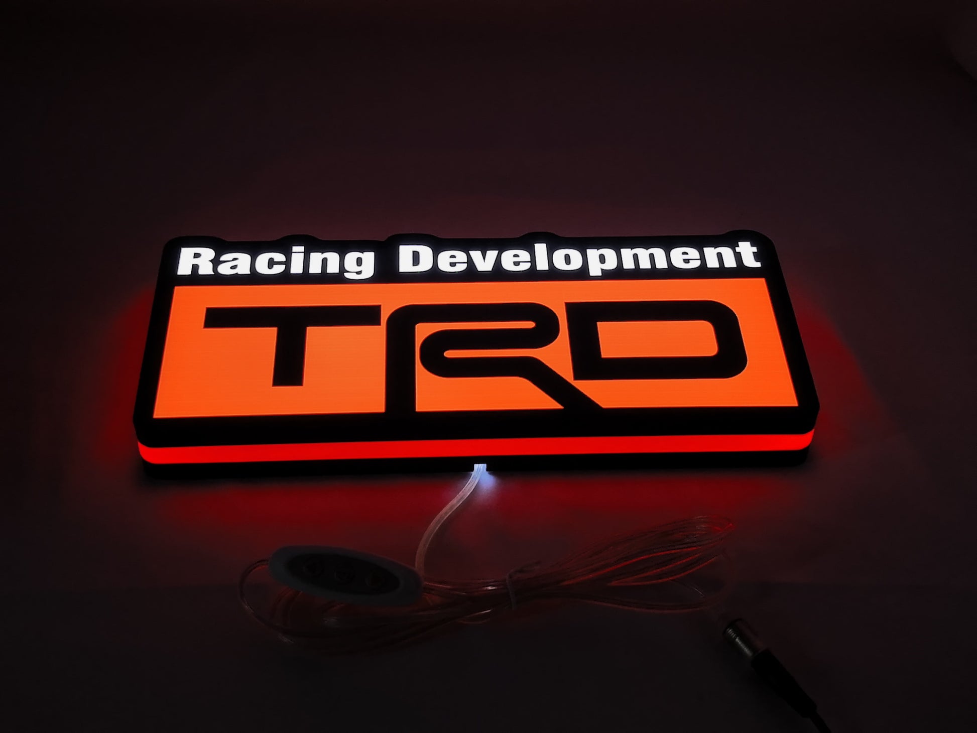 30cm Trd Racing Development Glowing Wall Art - Illuminated flat lay angled view, perfect for garage and man cave decor