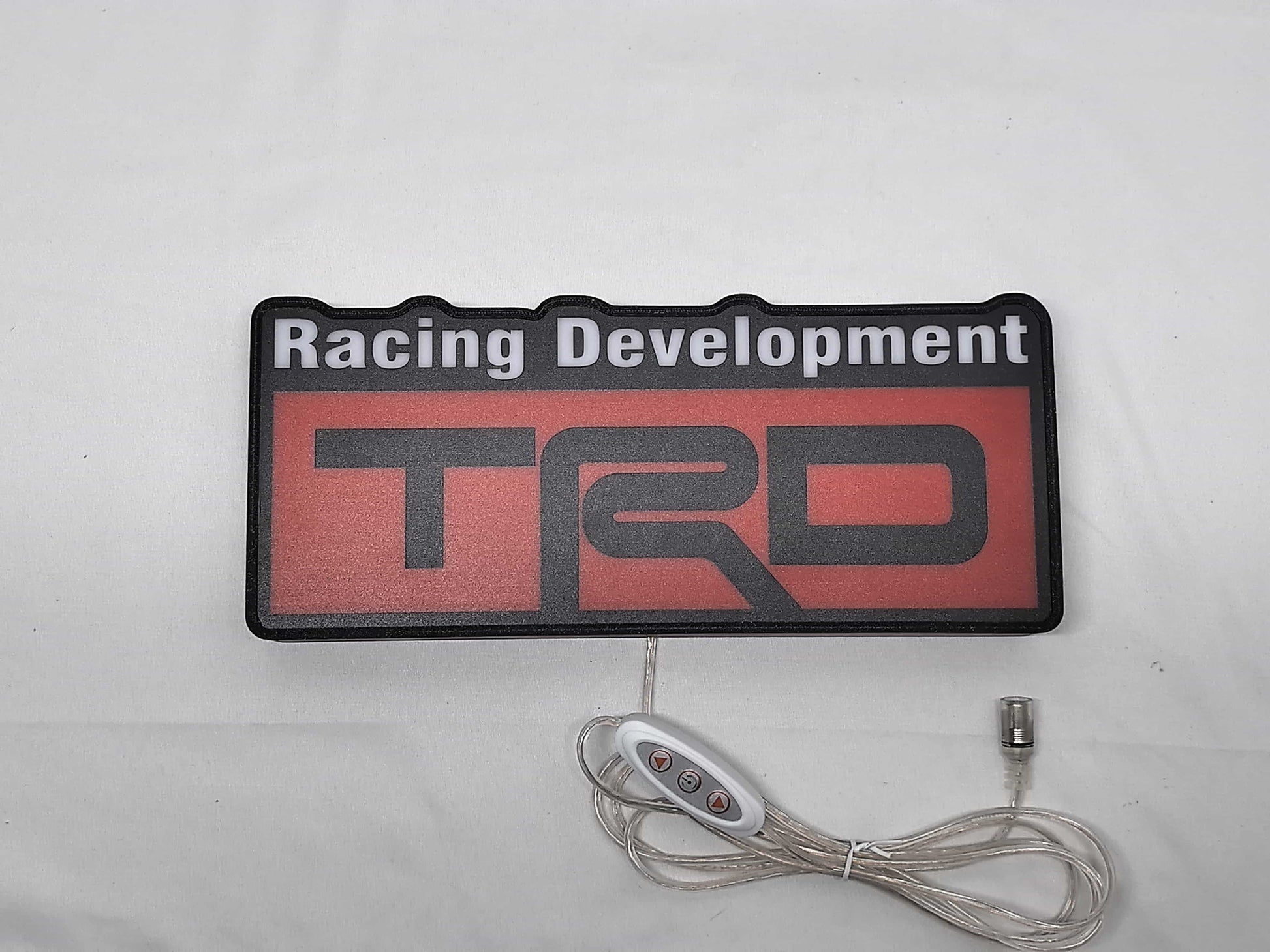 Unlit flat lay front details of Trd Racing Development 3D LED Sign in 30cm, perfect for garage and man cave decor