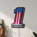Unlit Harley #1 Patch LED lightbox mounted on a wall in daylight