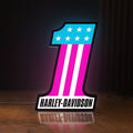 Front view of Harley #1 Patch LED lightbox sign glowing on a wooden desk