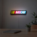 NASCAR LED lightbox hanging on a room wall with soft white light
