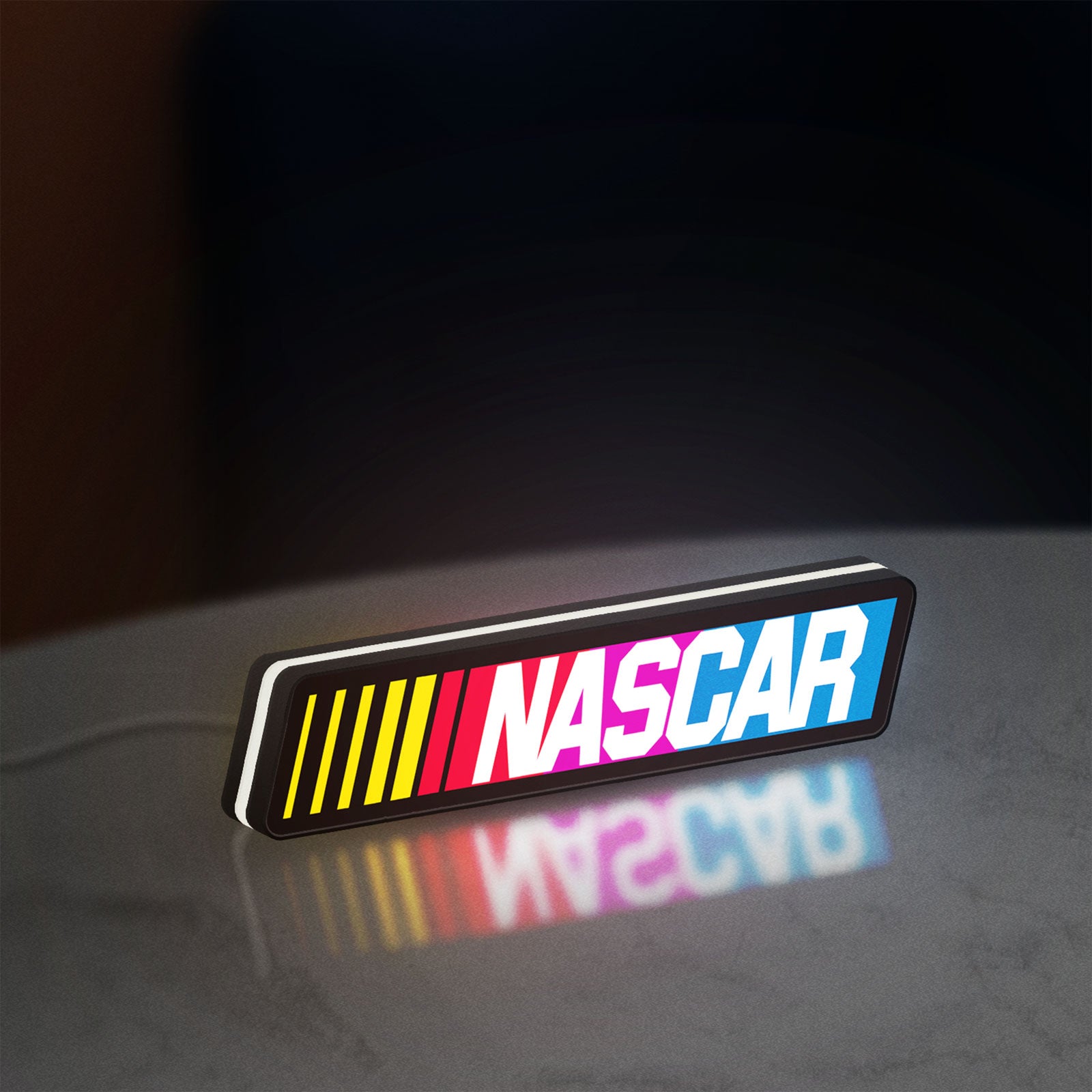 NASCAR LED lightbox standing on a desk from an angled side view with white glow