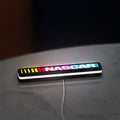 NASCAR LED lightbox lying flat on a desk with white glow