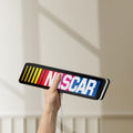 Unlit NASCAR LED lightbox held by hand to show size and details