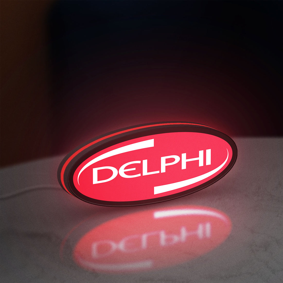 Delphi LED lightbox hanging on a wall with red glow