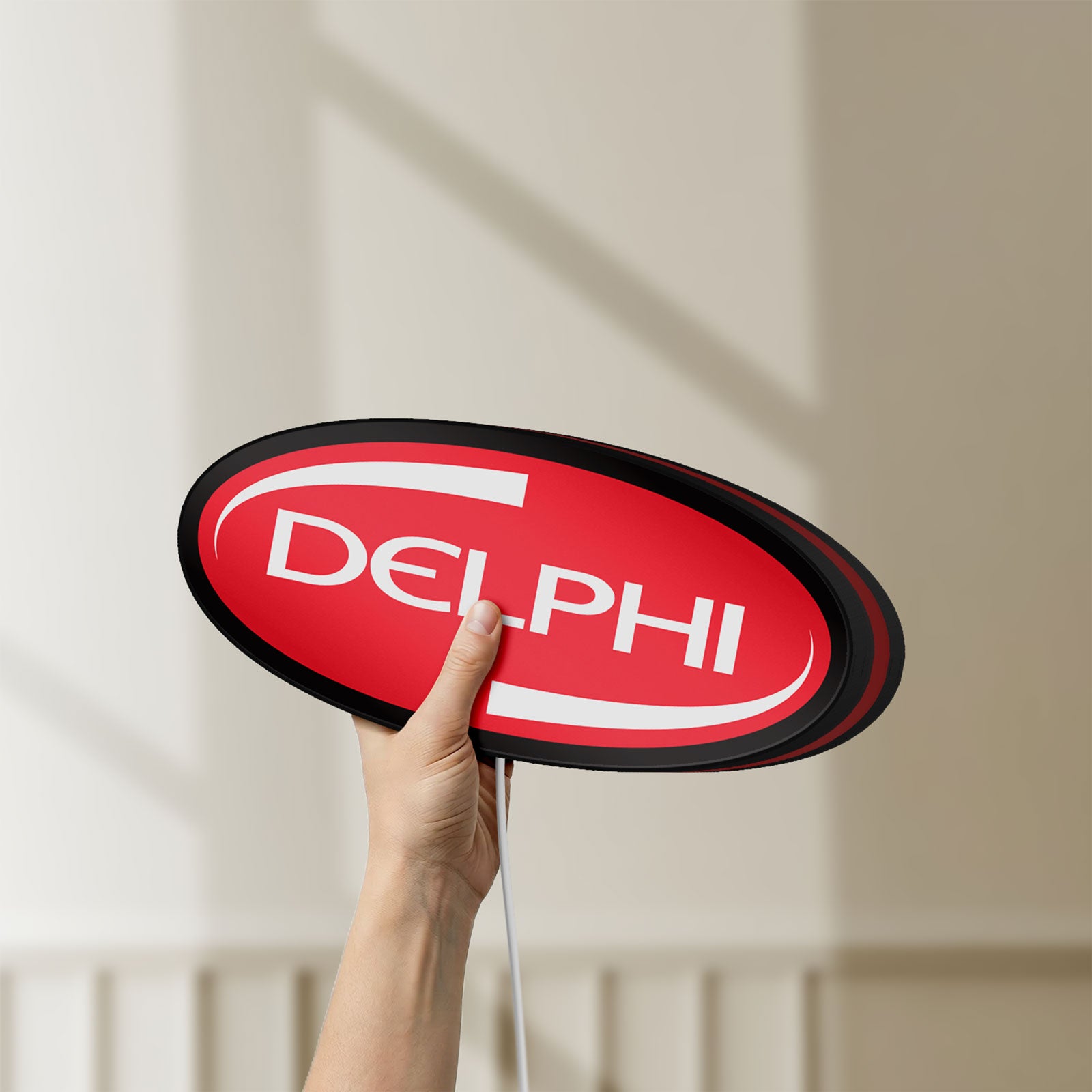 Unlit Delphi LED lightbox held by hand to show size and details