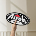 Unlit Airoh Helmet LED lightbox held by hand to show size and details
