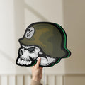 Unlit Metal Mulisha Skull LED lightbox held by hand to show size and details