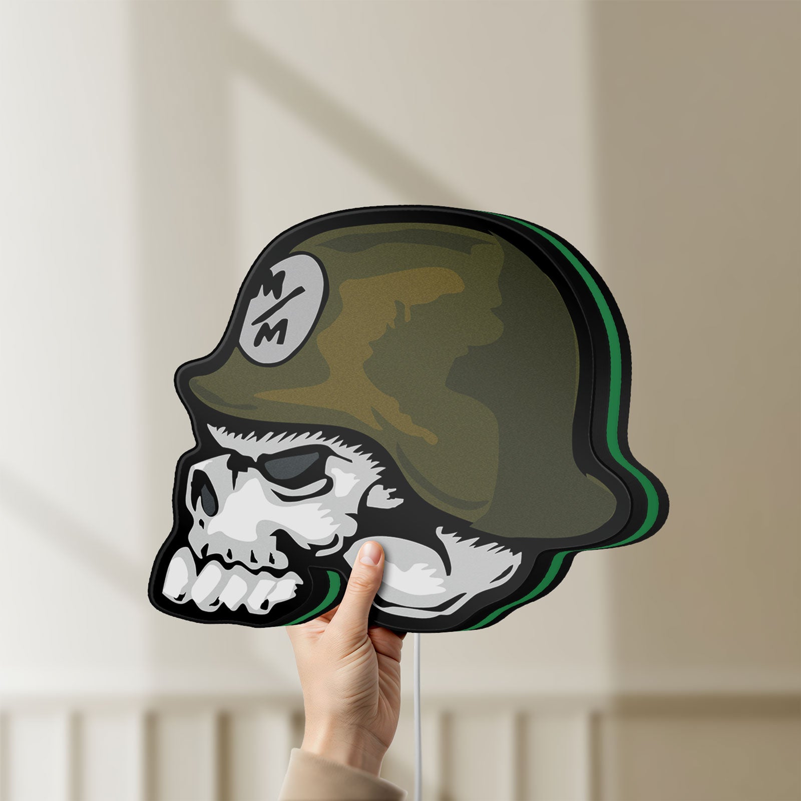 Unlit Metal Mulisha Skull LED lightbox held by hand to show size and details