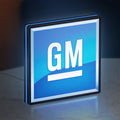 GM LED lightbox standing on a desk from an angled side view with blue glow