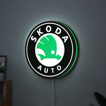 Skoda LED lightbox hanging on a wall with green glow