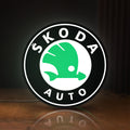 Front view of Skoda LED lightbox sign glowing on a wooden desk