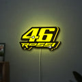 ROSSI 46 LED lightbox hanging on a wall with yellow glow