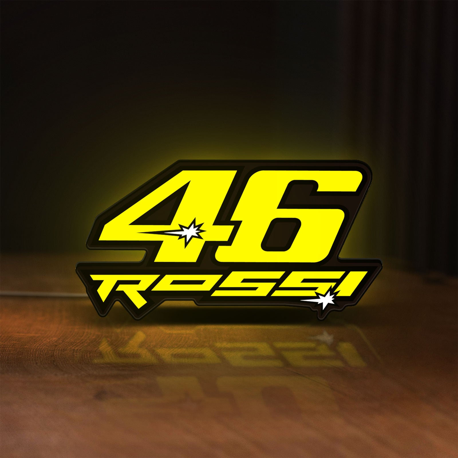 Front view of ROSSI 46 LED lightbox sign glowing on a wooden desk
