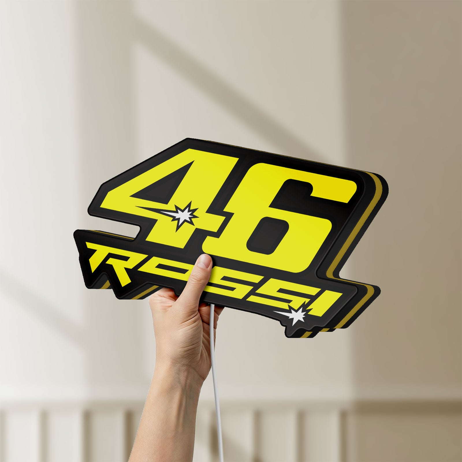 Unlit ROSSI 46 LED lightbox held by hand to show size and details