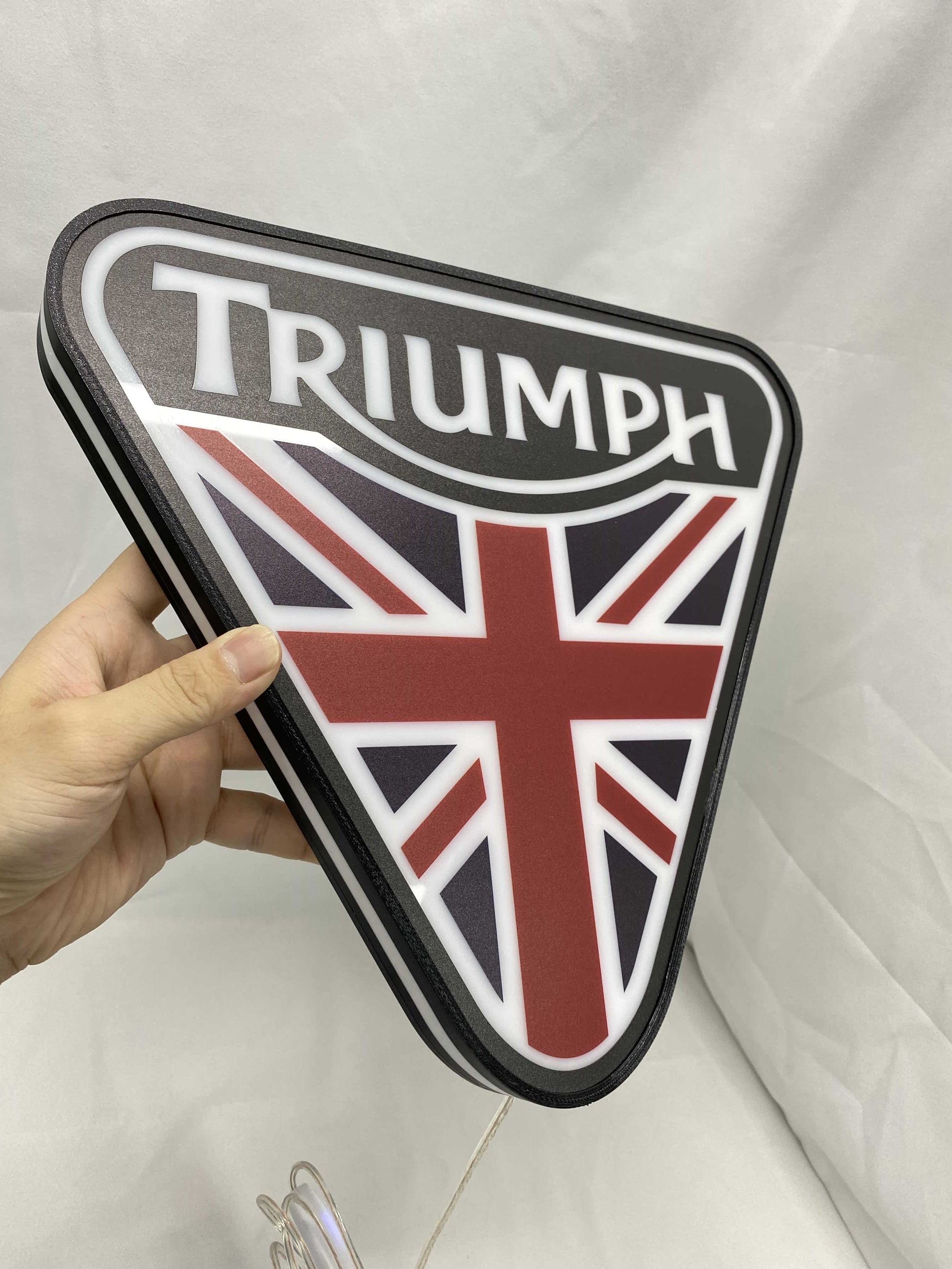 Unlit handheld size reference of Triumph 3D LED Sign in 30cm, unique wall art for desk and room decor