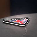 Triumph LED lightbox lying flat on a desk with white glow