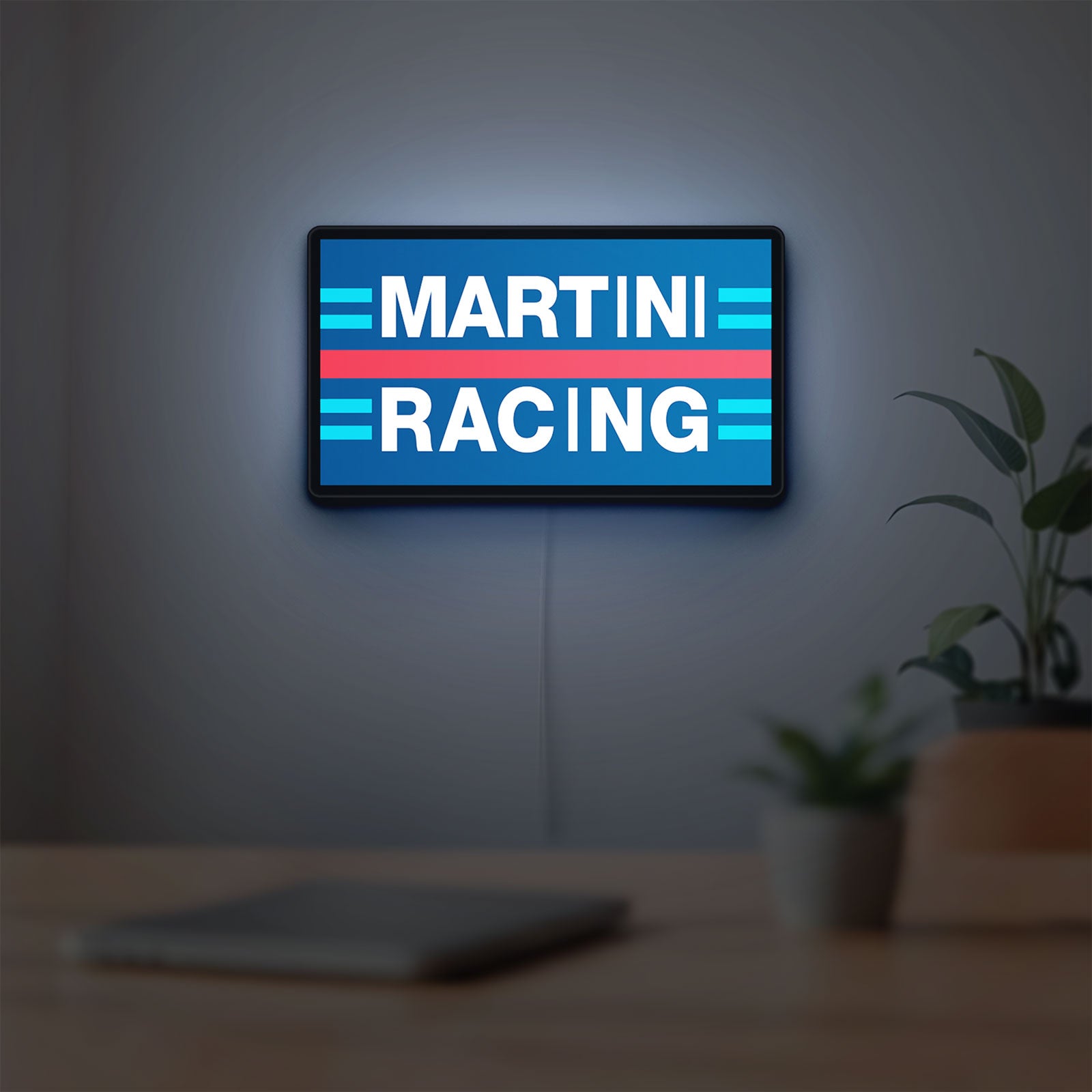Martini Racing LED lightbox hanging on a room wall with soft blue light